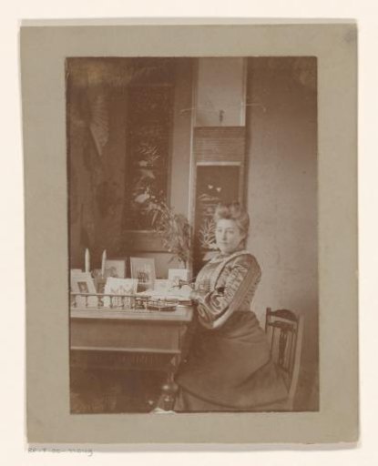 Portrait of a woman at a writing desk