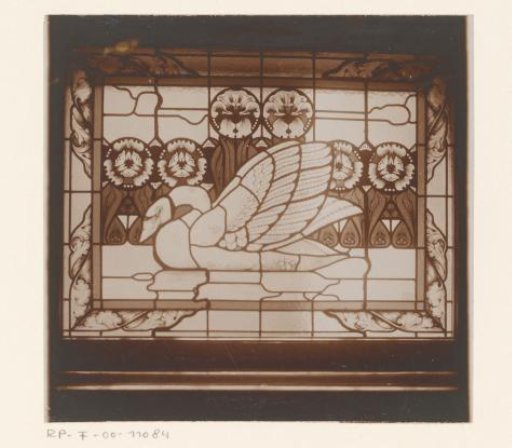 Stained-glass window with a swan by the water