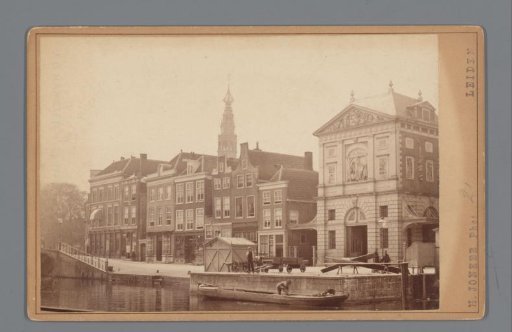 Street view with the Weigh House and the tower of the Town Hall in Leiden