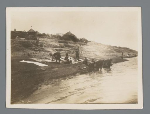 Women washing clothes in a river in Matam, Senegal