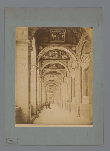 Painter at work behind an easel in the loggia of the Apostolic Palace in Vatican City, Italy