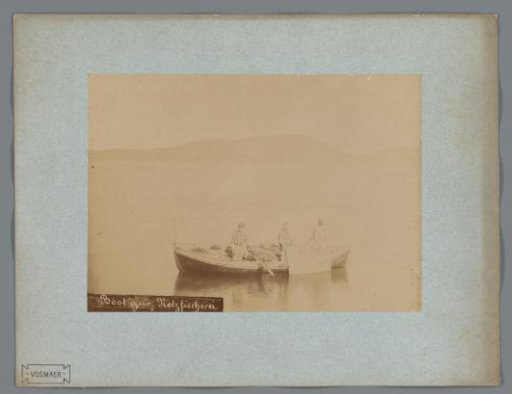 Fishing boat with three fishermen