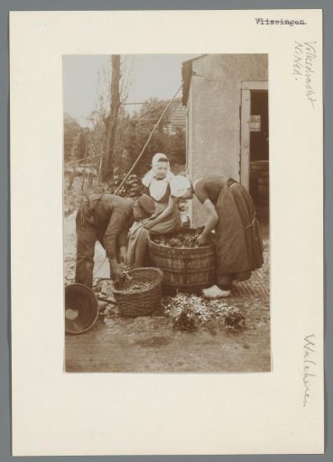 Two Girls and a Boy in Walcheren Costume Sorting a Crop