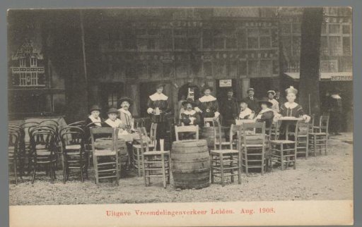 People in costume for a café during the Old Holland Festivals in Leiden