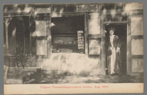 Woman in costume for a shop during the Old Holland Festivals in Leiden