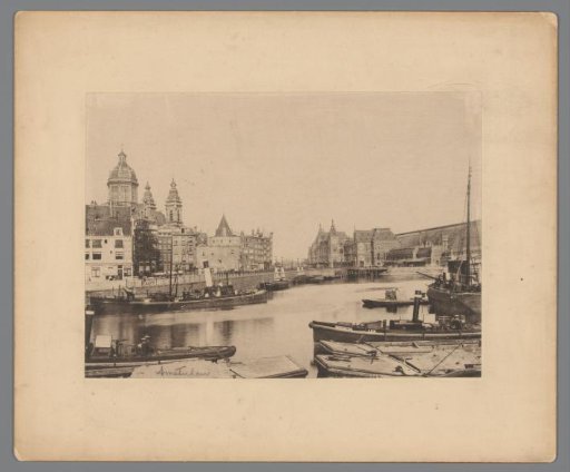 View of the Central Station, the IJ, the Sint-Nicolaaskerk and the Montelbaanstoren in Amsterdam
