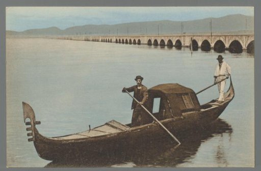 Venice. Gondola with Felze and the Railway Bridge
