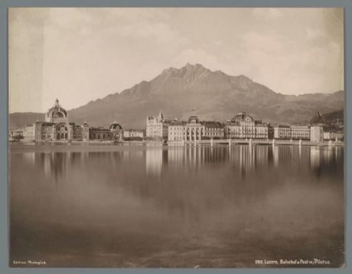 View of Lucerne from Lake Lucerne, left Lucerne station and in the background the Pilatus