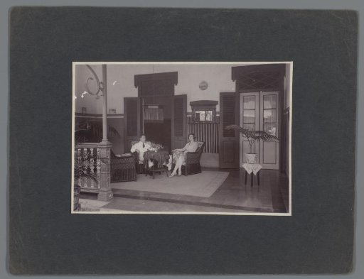 Portrait of an unknown couple on a veranda, Dutch East Indies