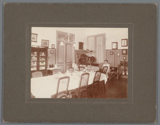Two women in a dining room