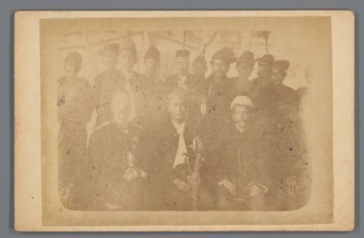 Group portrait of unknown men, likely colonial officials and local rulers, Dutch East Indies
