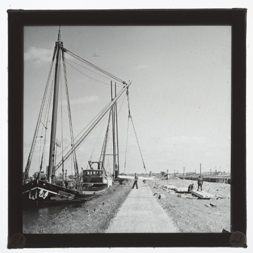 Ship unloading building materials, South Holland