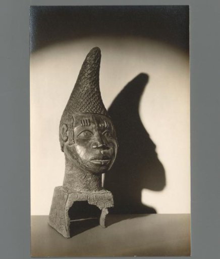 Sculpture of a Man's Head with a Pointed Cap