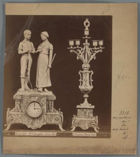 Photographic reproduction of an ornamental clock and candlestick