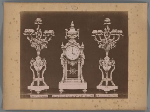 Photographic reproduction of two candlesticks and a clock