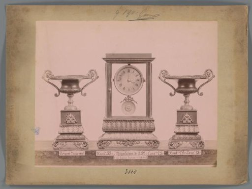 Photographic reproduction of two decorative cups and a clock