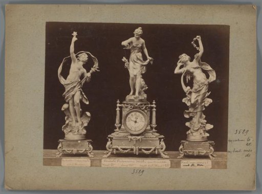 Photographic reproduction of two sculptures and a clock with female figures