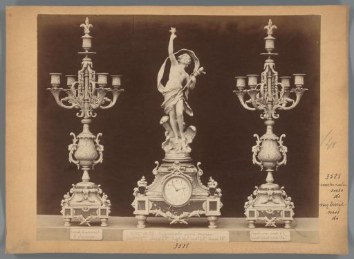 Photographic reproduction of two candlesticks and a clock with a figure by Louis Moreau