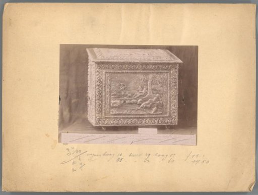 Photographic reproduction of a chest with woodcarving