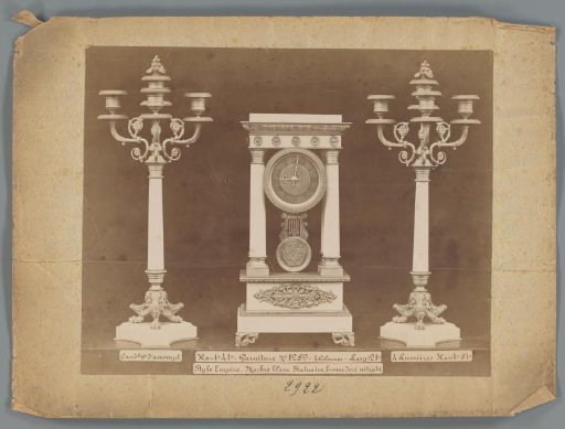 Photographic reproduction of two candlesticks and a clock of marble and gilded bronze