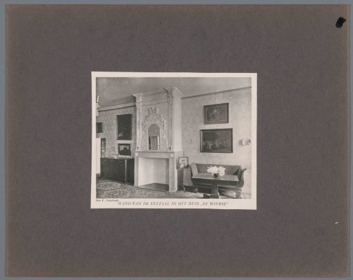Wall of the dining room in Castle De Wiersse in Vorden with a fireplace and a bench