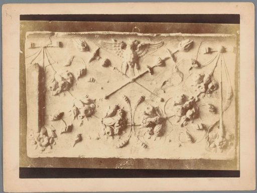 Relief with bird, torches and fruits