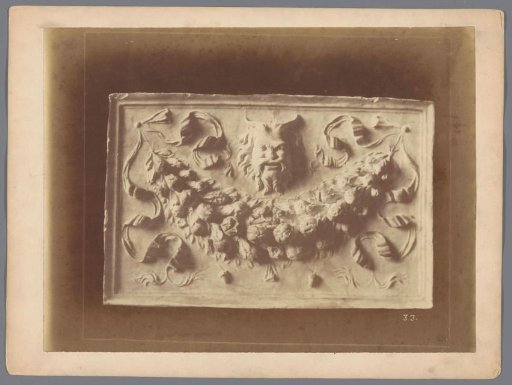 Relief with a garland and a mask head