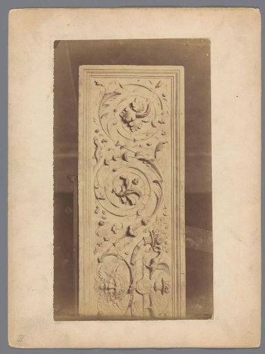 Relief with arabesques and a mask head