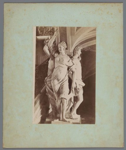 Three sculptures around a pillar