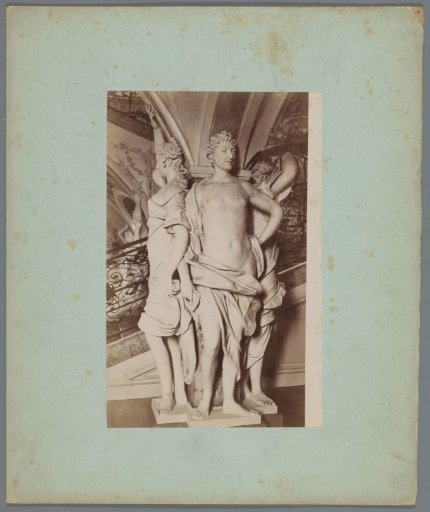 Three sculptures around a pillar