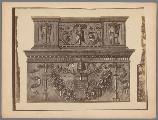 Relief with the coat of arms of Vatican City, a garland, and a mask head