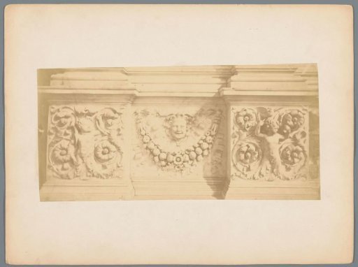 Relief with a mask, floral motifs, and putti