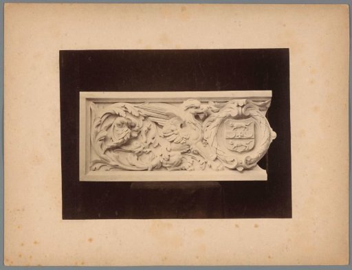 Relief with a fantasy creature and a wreathed coat of arms