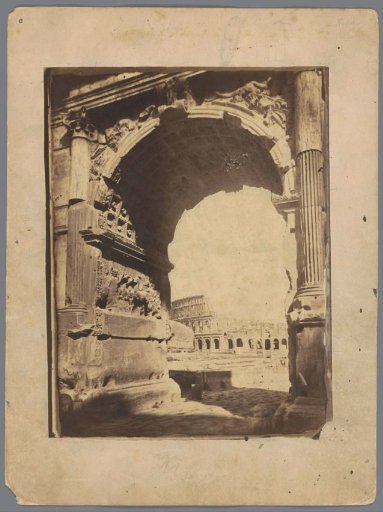 Arch of Titus on the Roman Forum in Rome, with the Colosseum in the background