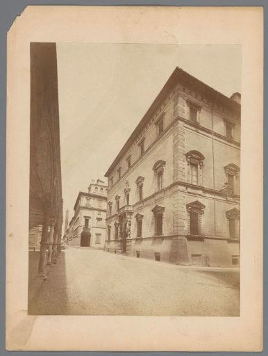 Street view with Palazzo Davia Bargellini on the right and the Asinelli Tower in the distance in Bologna