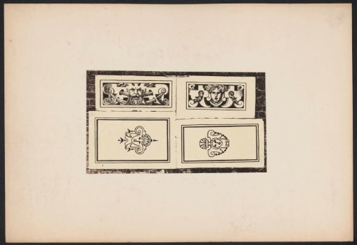 Four ornamental prints with masks on a wall
