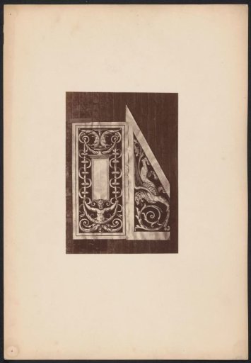 Two ornamental prints with a winged lion on a wall