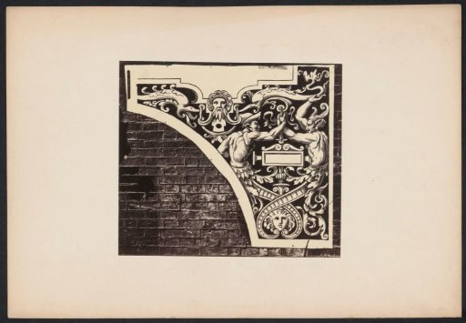 Ornamental print with two fantastic creatures on a wall