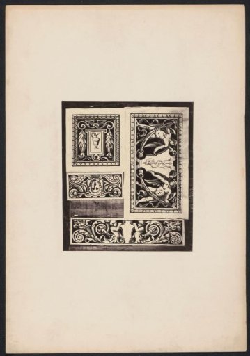 Four ornamental prints with winged figures and a mask on a wall