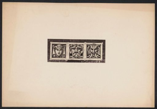 Three mask heads on a wall