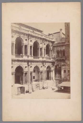 Courtyard of a building with two colonnaded galleries