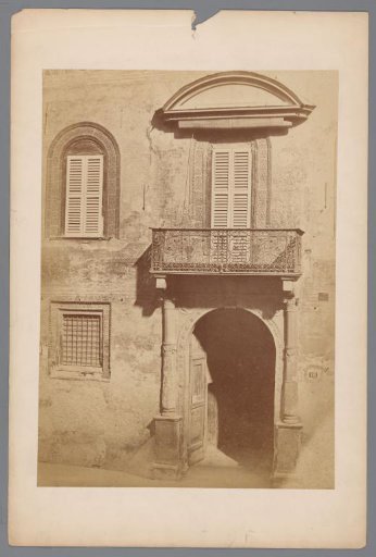 Facade of a building with a gate and a balcony