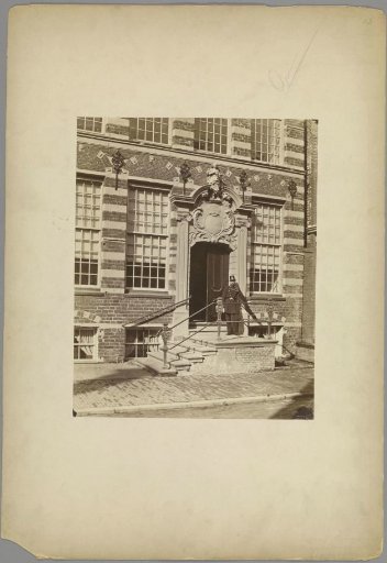 Entrance of the courthouse on the Oude Boteringestraat in Groningen with a man in uniform in front of the door