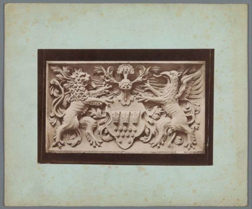 Relief with a coat of arms between a heraldic lion and griffin
