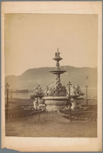 Fountain with Nereids, with a river and hilly landscape in the background