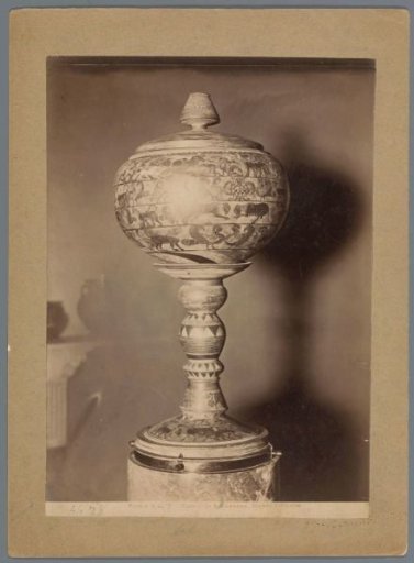 Bulbous vase on a foot decorated with mythical creatures