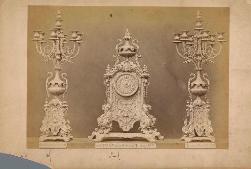 Table clock with two candlesticks