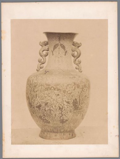 Vase with two handles decorated with floral motifs, birds, and fish