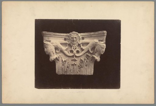 Capital decorated with human heads
