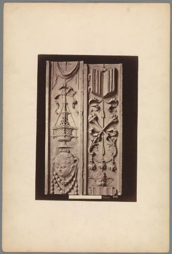 Reliefs with a child's head and bunches of fruit (probably) from the Charterhouse of Pavia